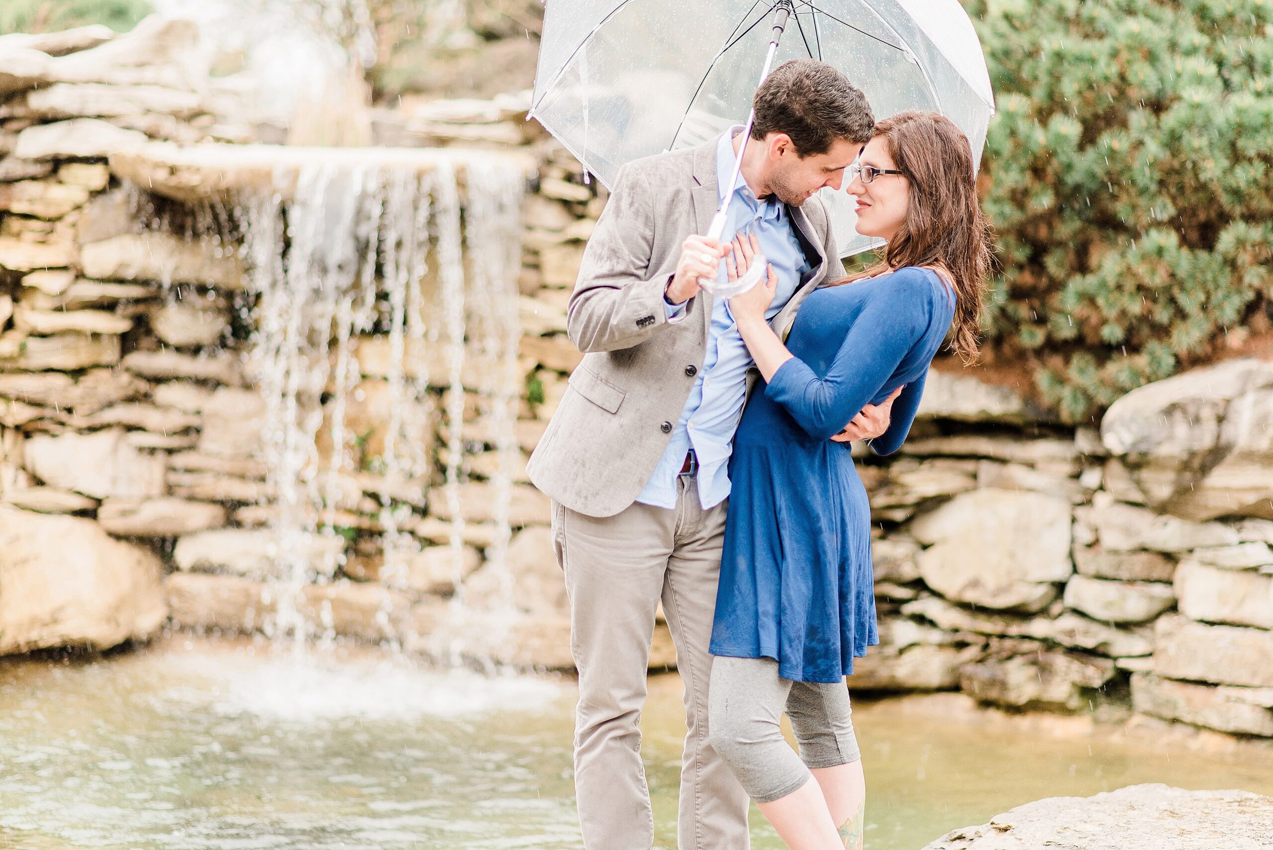 Oliver Winery Engagement Session waterfall rain